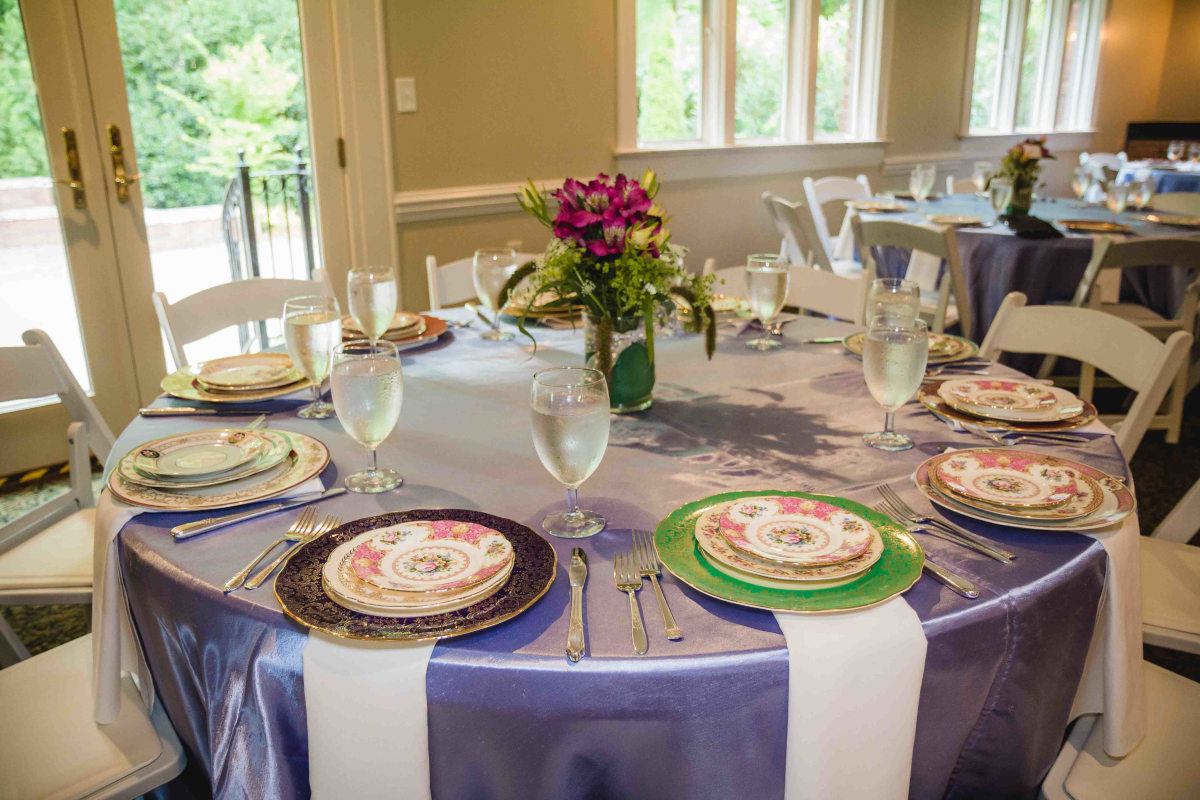 colorful plates on purple tablecloth